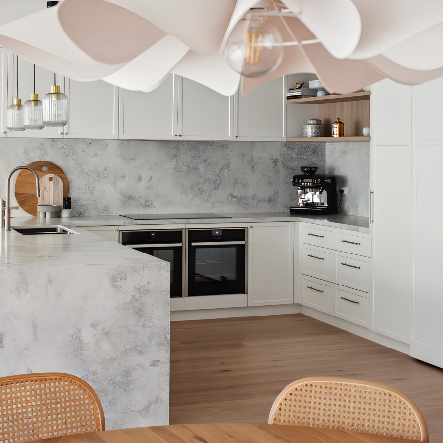 White kitchen with wraparound benchtops, integrated appliances and a dedicated coffee area