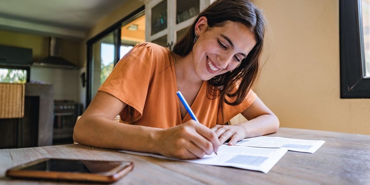 woman signing bathroom renovation contract